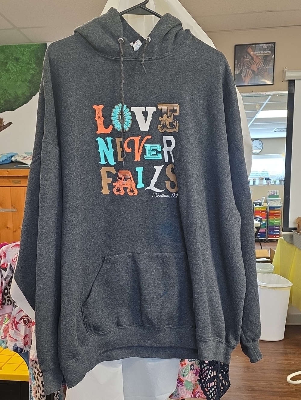 Jerzees Dark Charcoal Hoodie with Colorful "Love Never Fails" Graphic